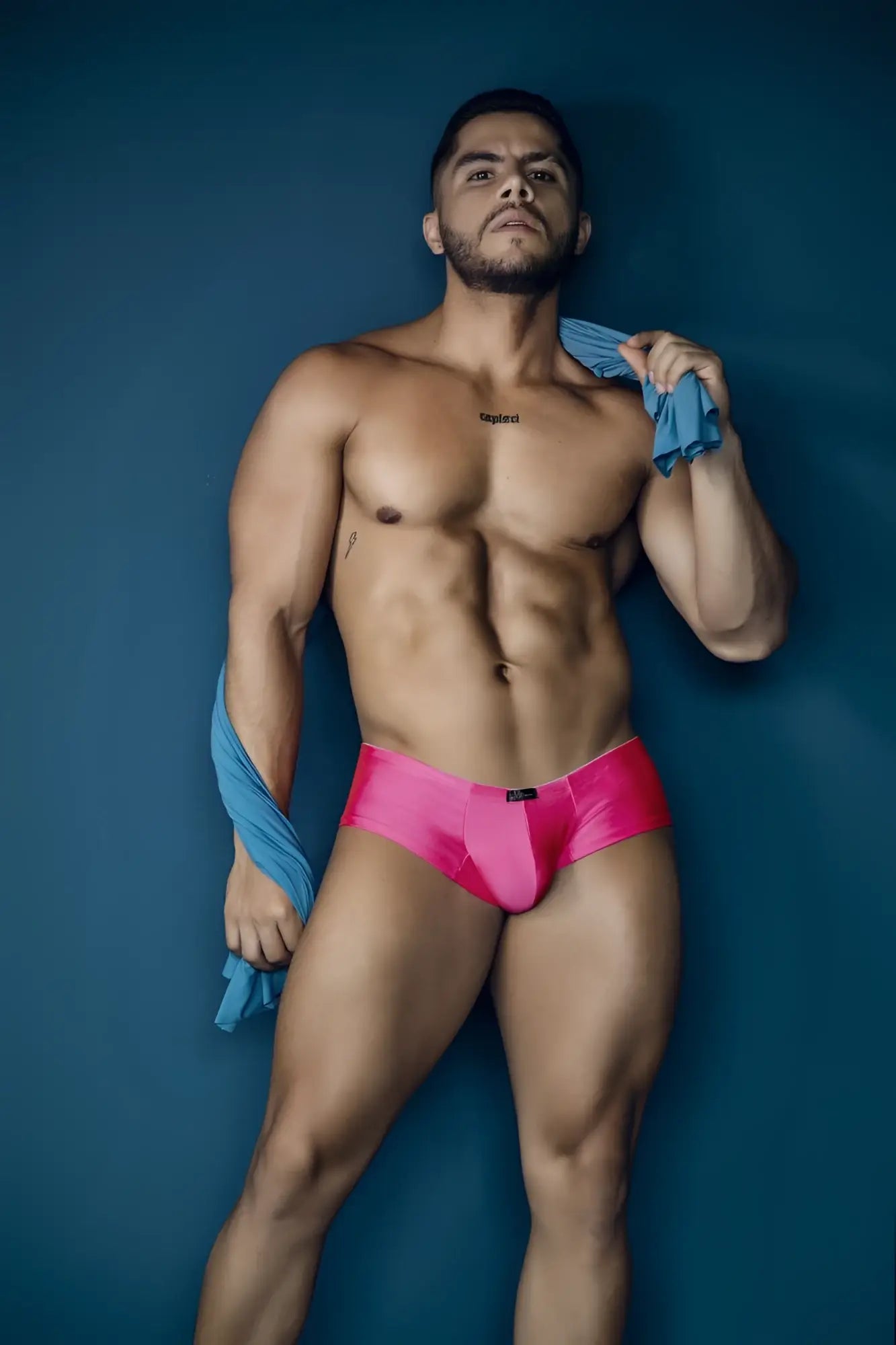 Vibrant pink xtremen 91234 microfiber trunks with sleek satin finish and black brand tag at waistband front view