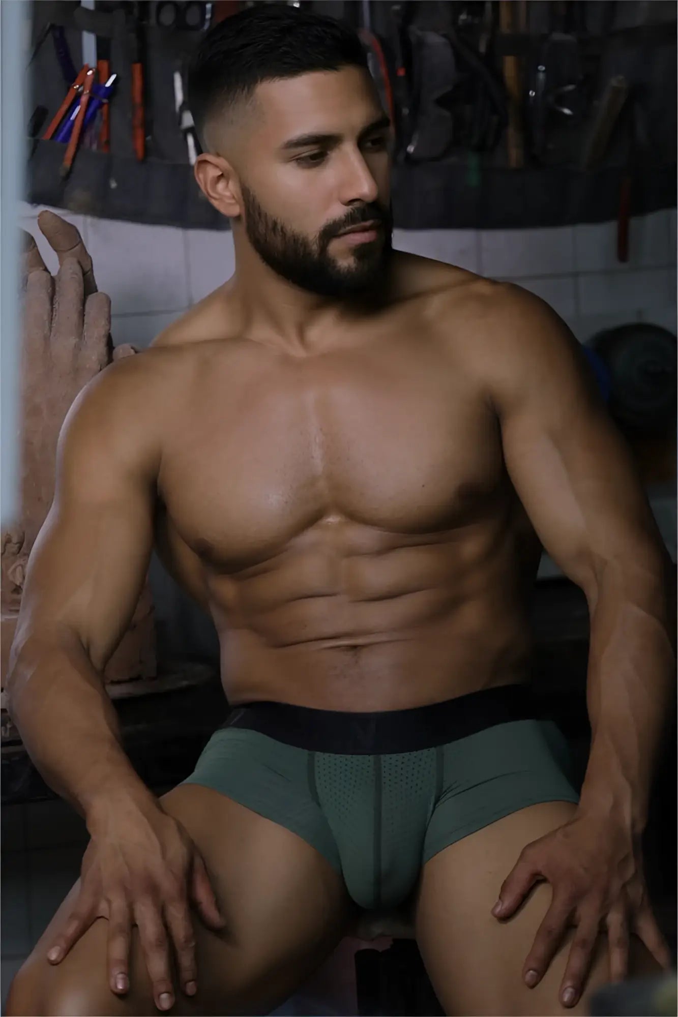 A pair of xtremen 91252 microfiber mesh trunks in military green with a black elastic waistband and form-fitting design
