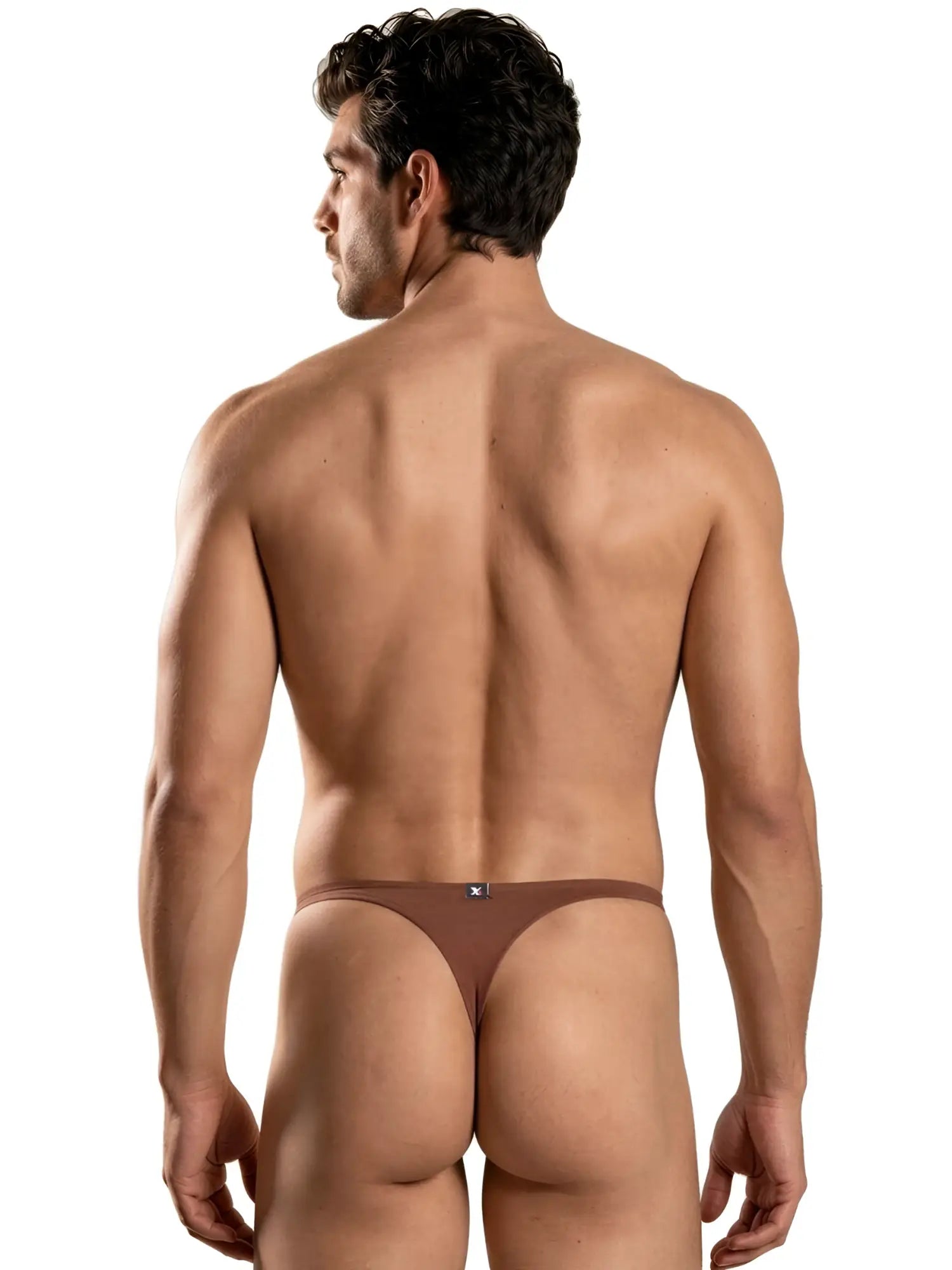 A man wearing brown Xtremen thongs, shown from a rear view against a white background.