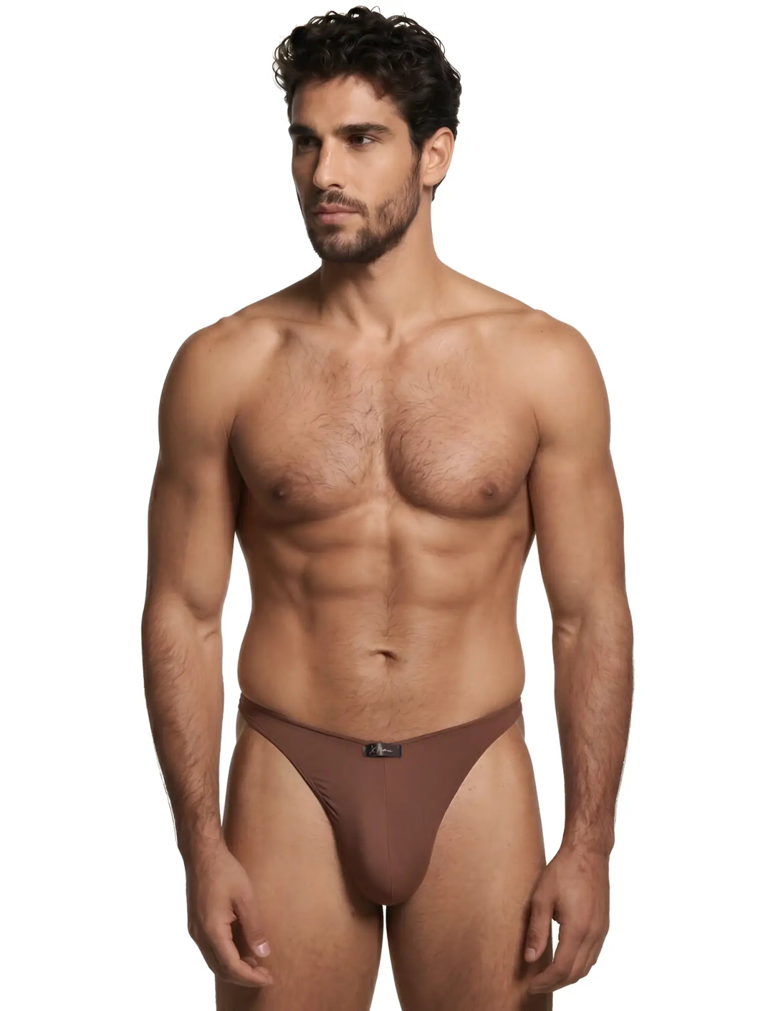 A muscular man wearing solid brown Xtremen thongs with a center logo tag against a white background.
