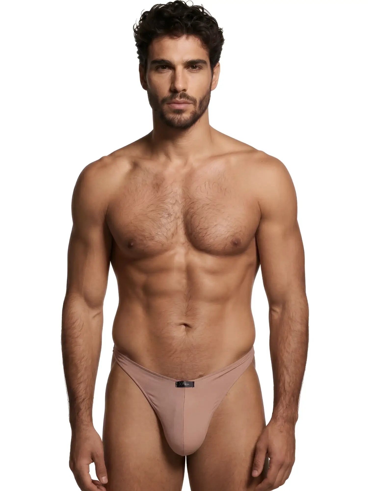 A model wearing a light brown Xtremen thong with a central brand logo tab, isolated against a white background.
