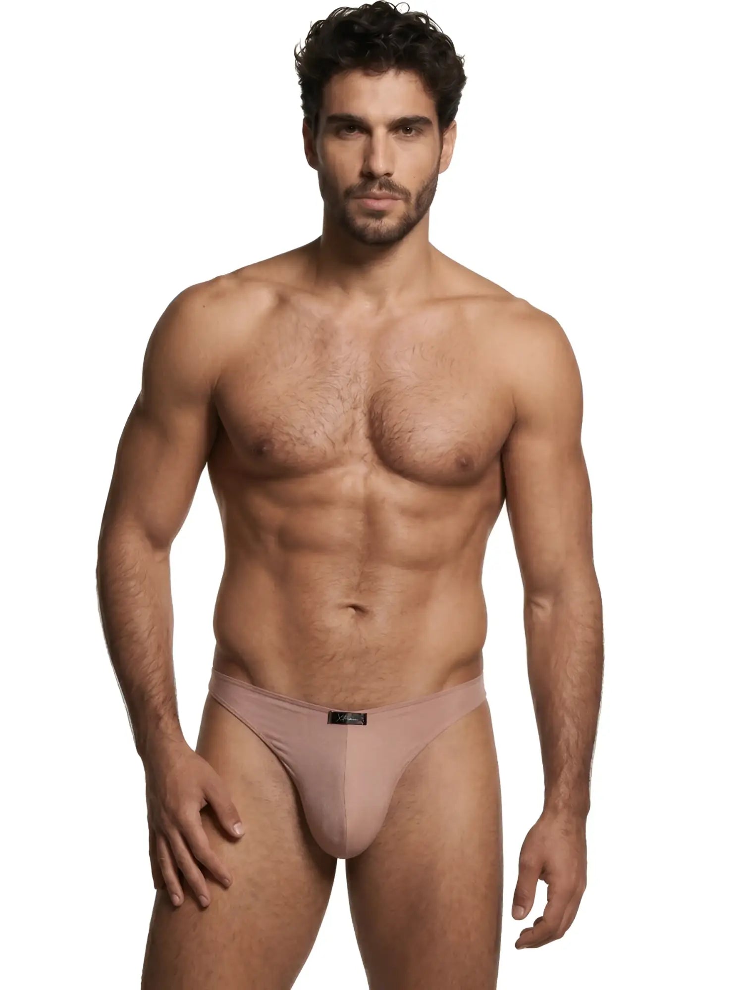 Xtremen men’s beige bikini underwear featuring a logo patch on the waistband, modeled by a shirtless man.