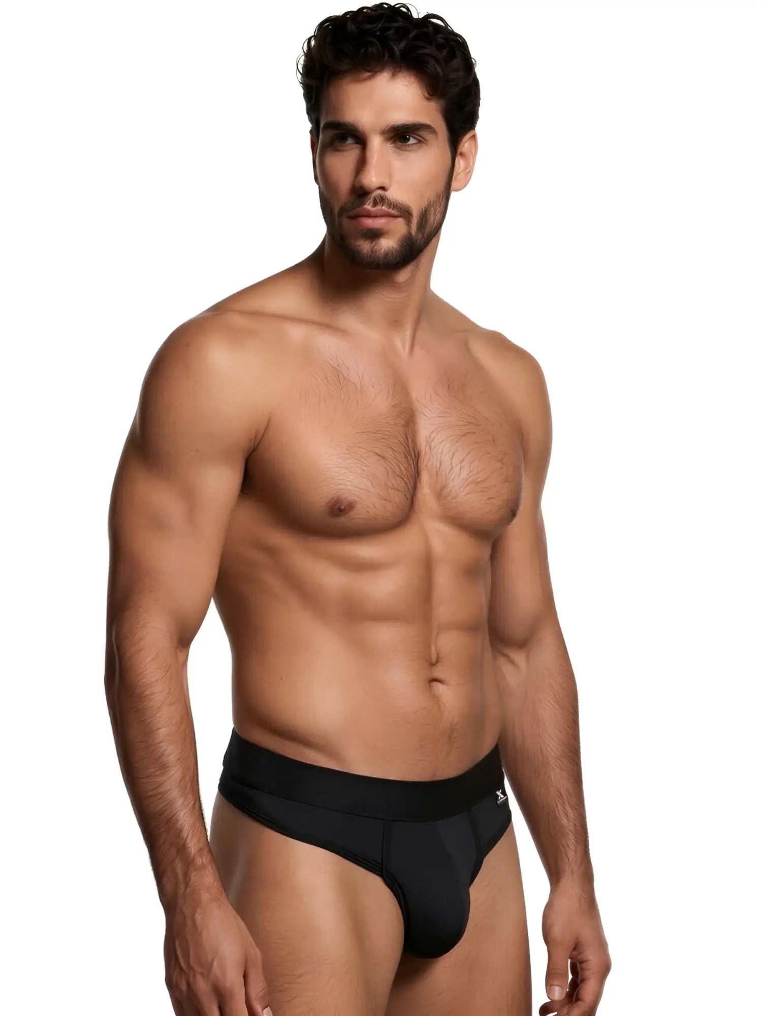 A shirtless man wearing a solid black Xtremen men's thong with a logo waistband.