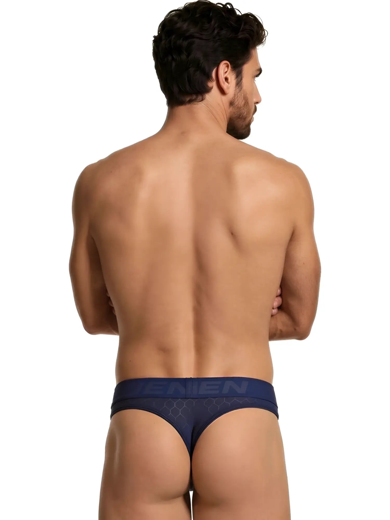 Xtremen navy blue thong with a geometric hexagon pattern and branded waistband on a man from behind.