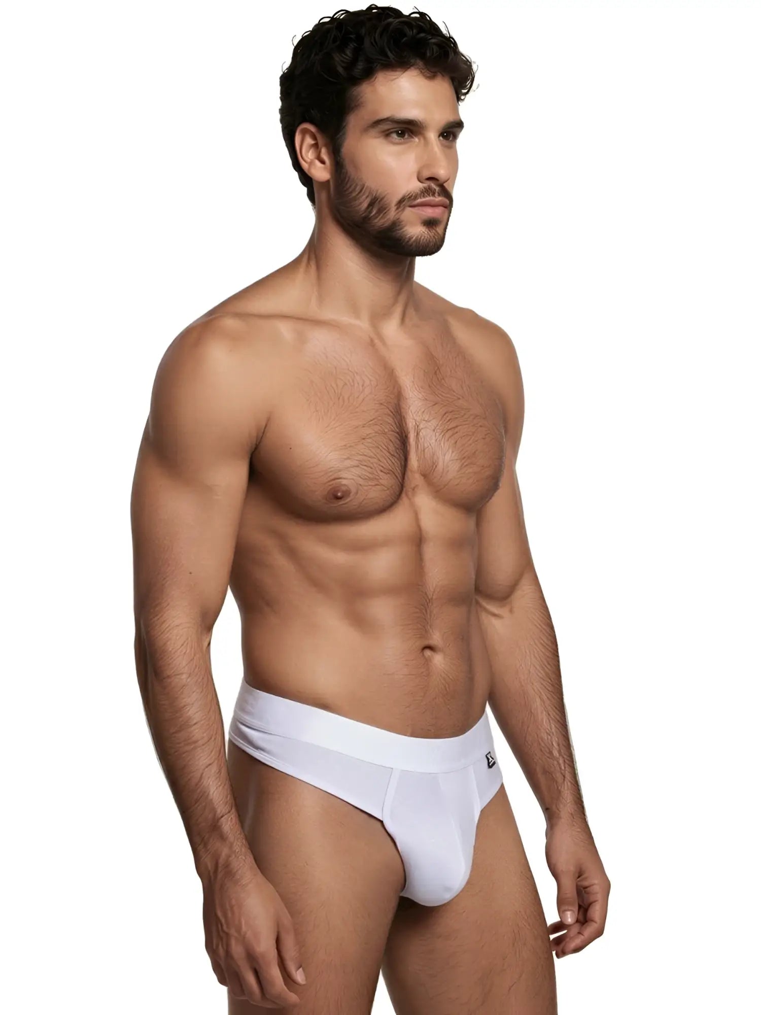 Xtremen men’s white thong with a subtle geometric textured pattern, worn by a fit male model.