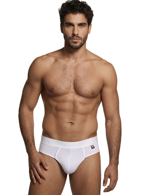 Man wearing white Xtremen thong underwear with a branded waistband logo.