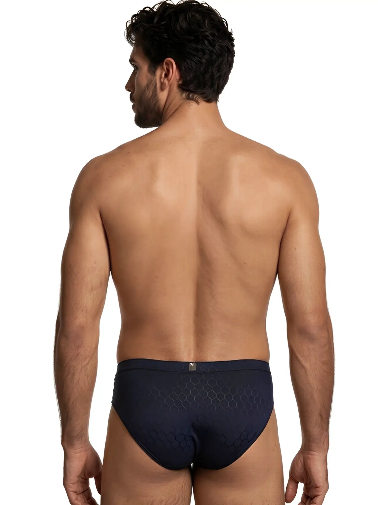 Back view of a man wearing navy blue Xtremen briefs with a subtle black honeycomb pattern.