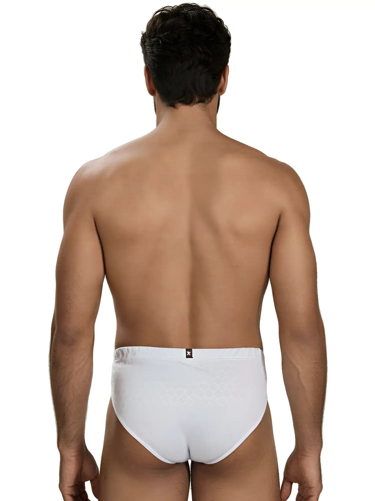 Rear view of a man wearing white Xtremen briefs with a subtle honeycomb textured pattern.