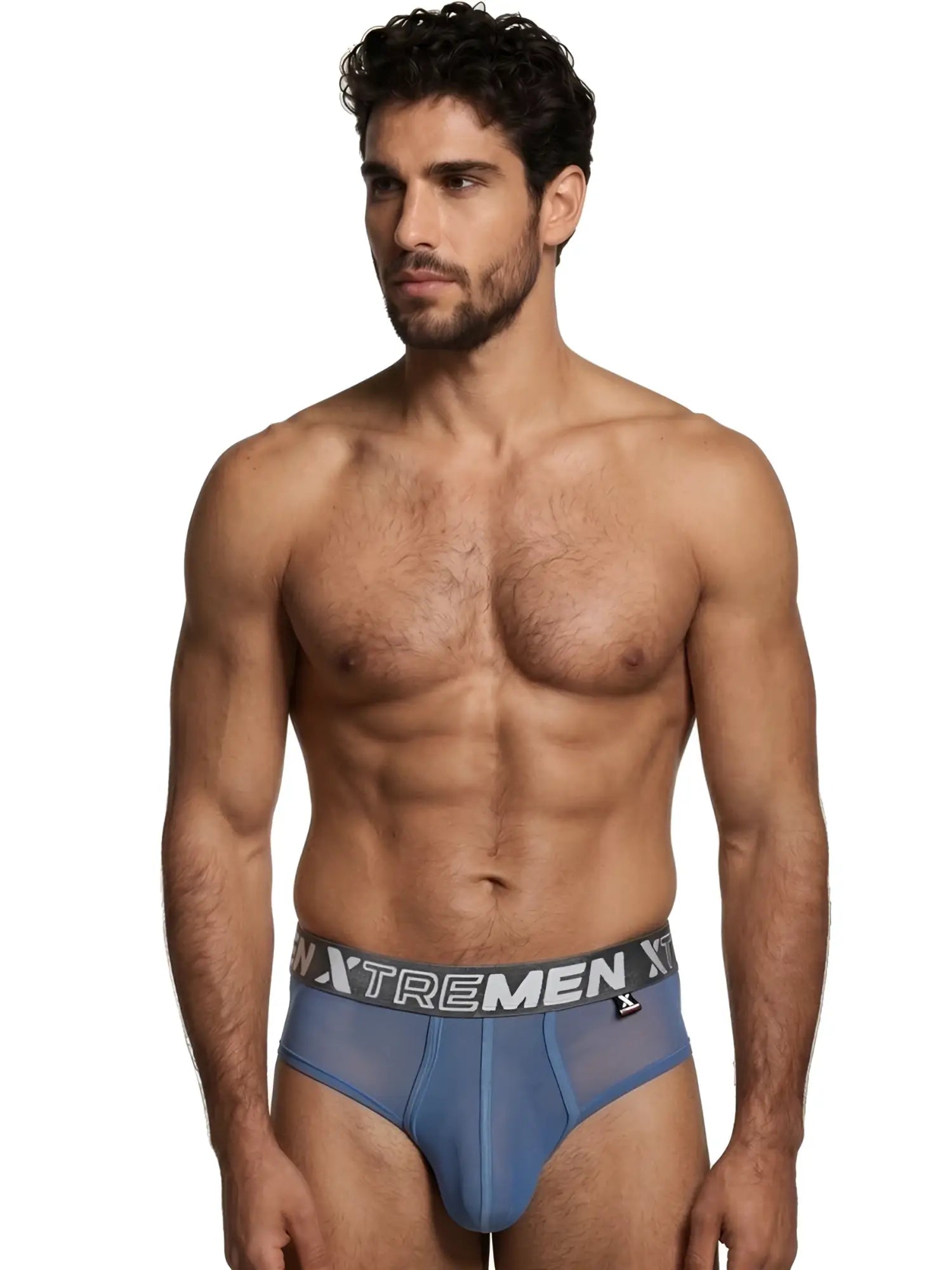Model wearing blue sheer Xtremen briefs with a grey branded waistband against a white background.