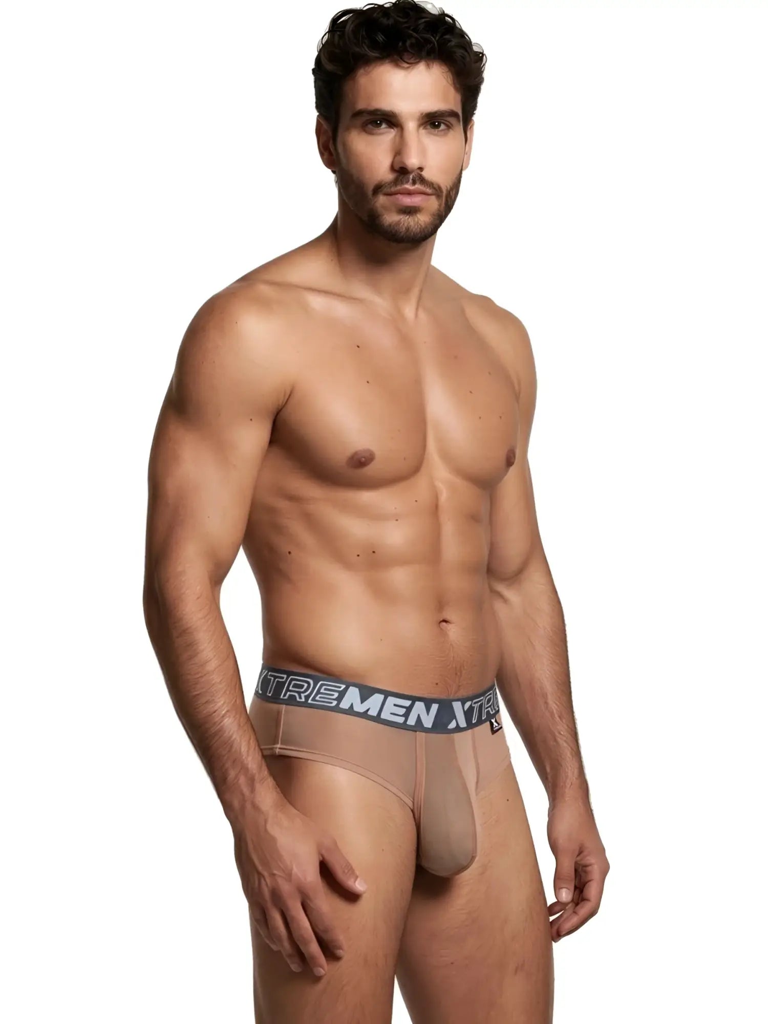 Model wearing nude-colored Xtremen sheer briefs with a grey branded elastic waistband.