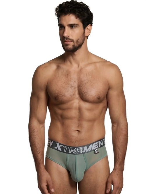 Xtremen sage green sheer briefs with grey branded elastic waistband on a fit male model.