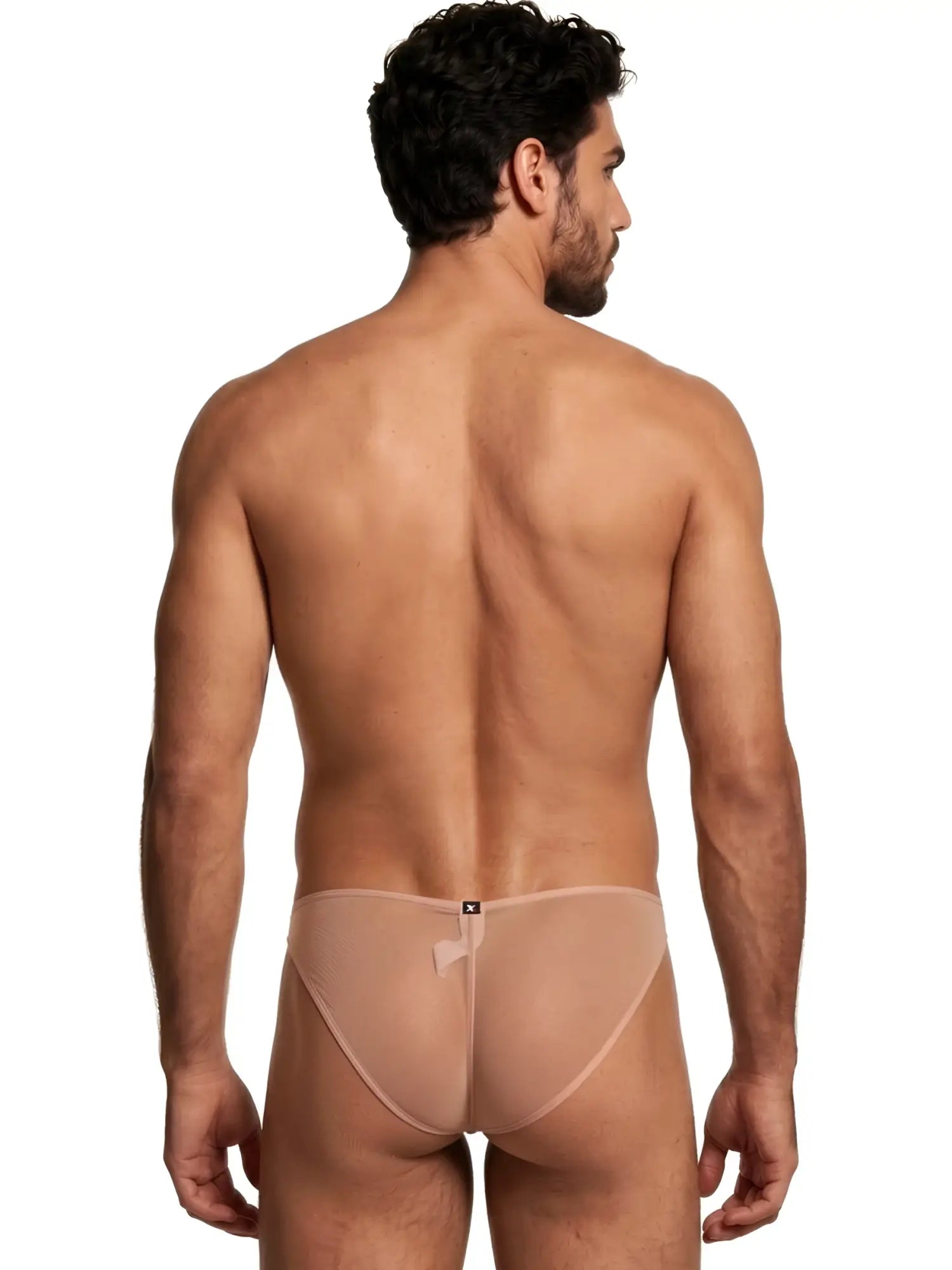Rear view of a man wearing a sheer, beige Xtremen bikini brief with a center back logo tag.
