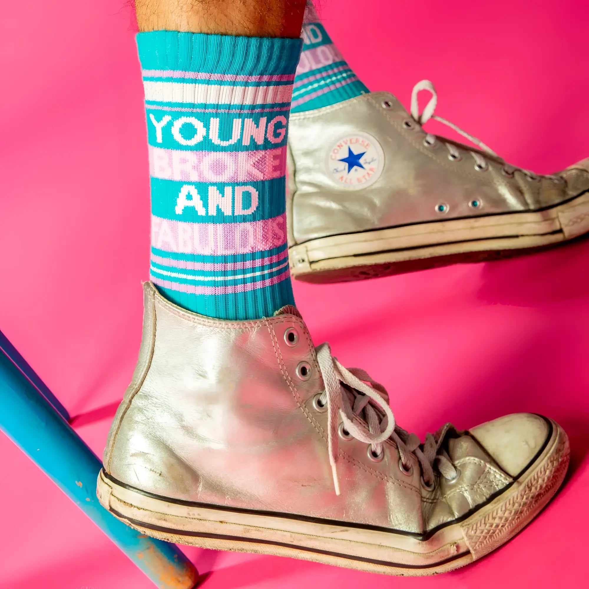 Young broke and fabulous crew socks paired with silver high-top converse all-stars with white laces and faded sole