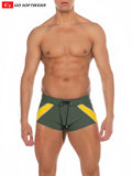 Men’s zanzibar square-cut swim trunks in olive green and yellow with black drawstring waistband for swimming