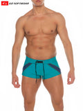 Zanzibar square-cut swim trunks in turquoise and navy blue with black drawstring for beachwear