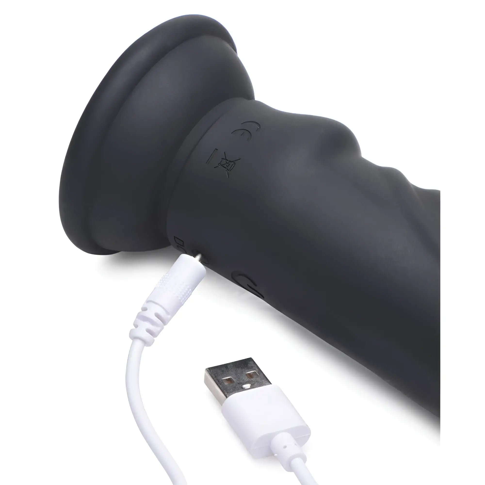 Zeus Electrosex E-Stim Pro 5x vibrating dildo in matte black being charged with a white USB cable on a white background.