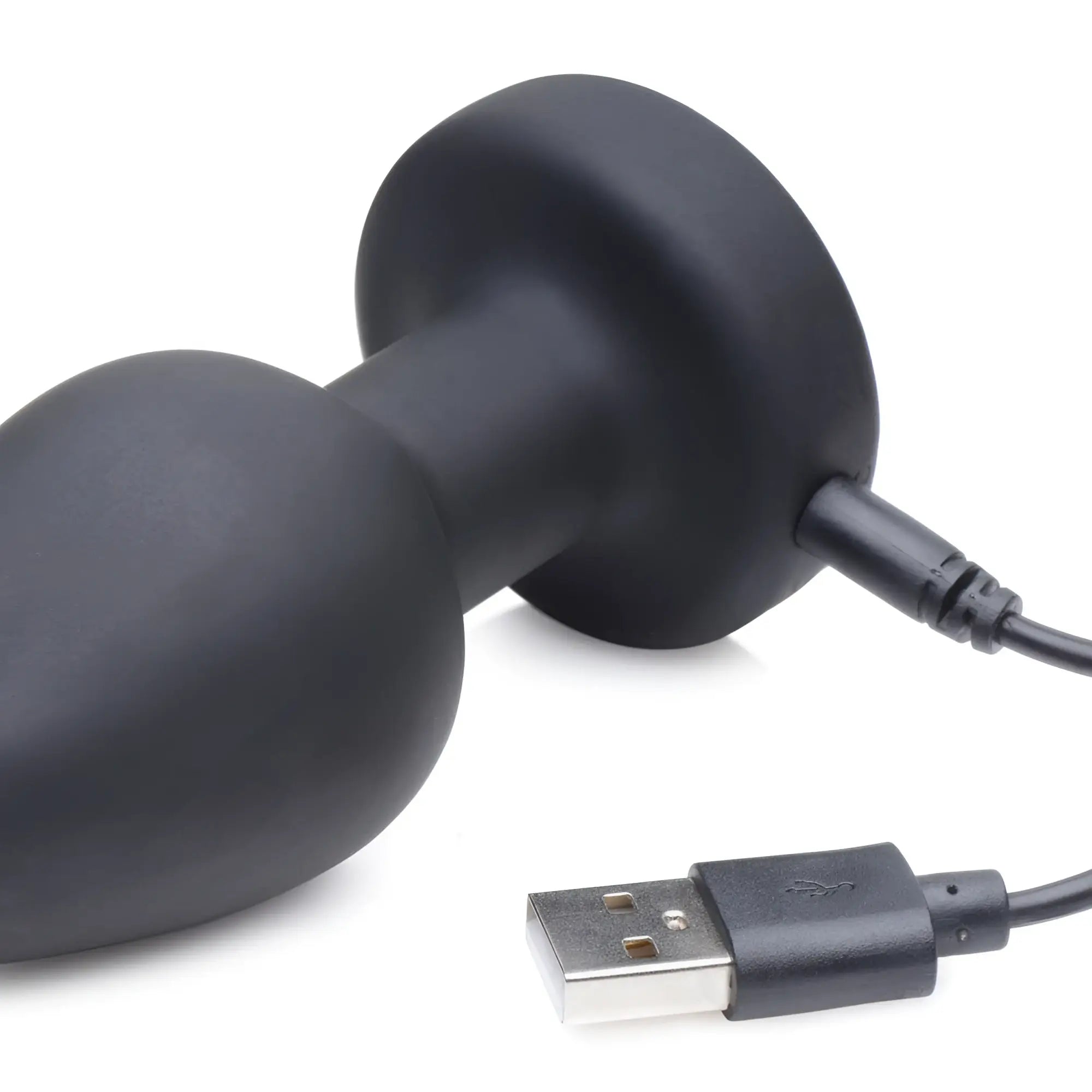 Zeus E-Stim Pro black silicone anal plug with a USB charging cable, shown against a white background.