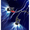 Zeus Electrosex black clamps with red connectors connected by black wires against a bright blue lightning background.
