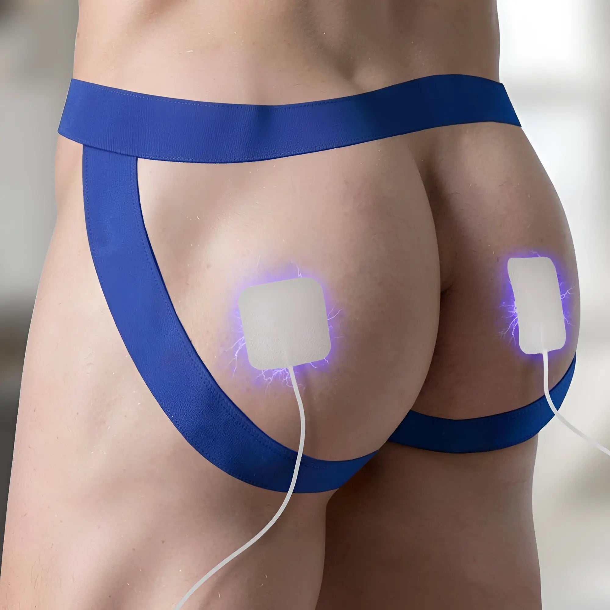 Zeus Electrosex Palm Power Box: Blue jockstrap with electrode pads producing glowing purple electrical arcs on buttocks.