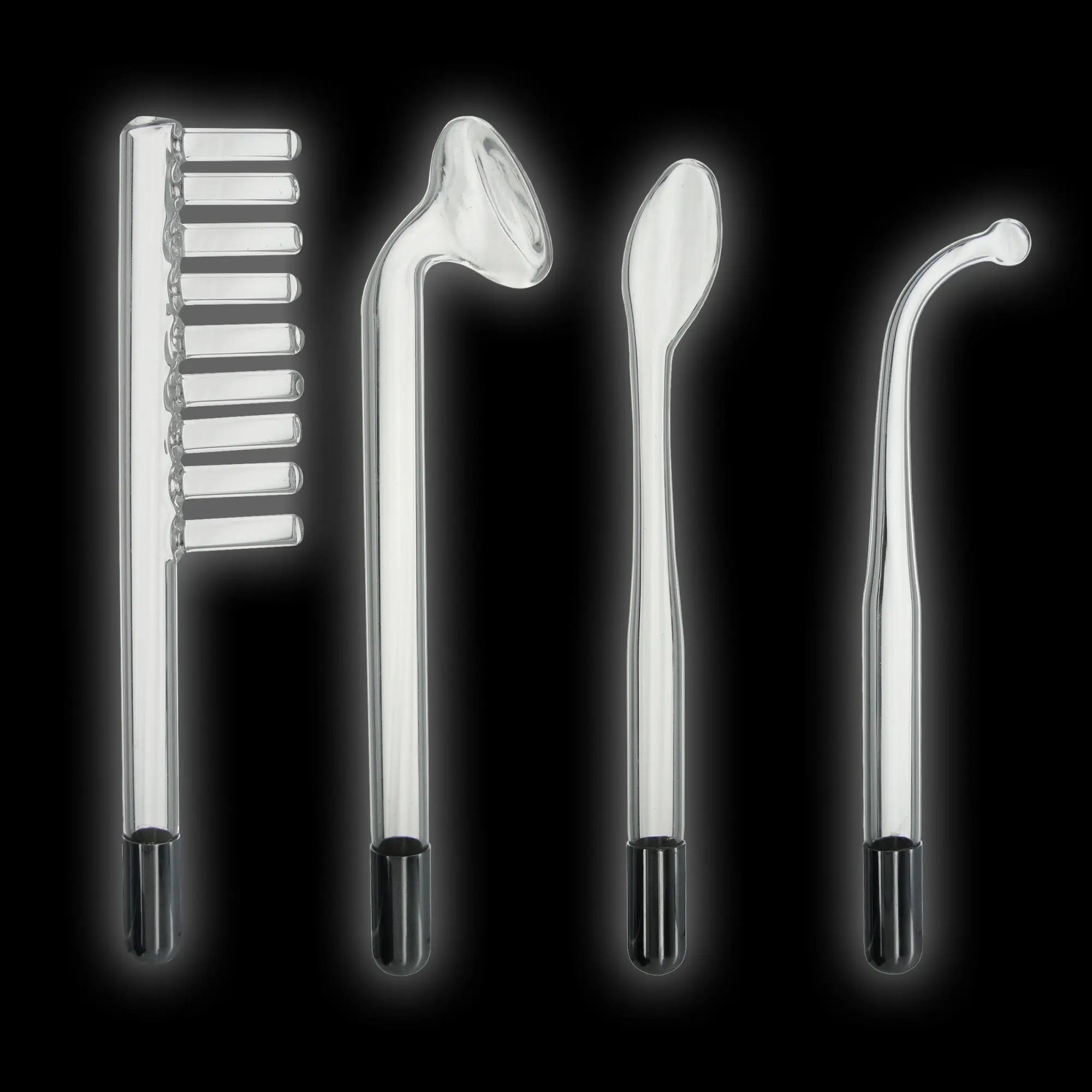 Zeus Twilight Wand set: four clear, glass electrostimulation attachments with black bases against a black background.