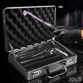 Zeus Electrosex Ultimate Edition Violet Wand set in a silver case with various glass attachments and active electrical glow.