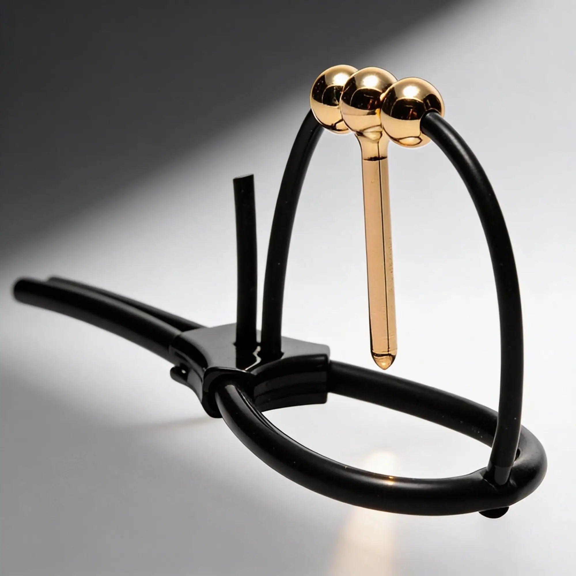 Zeus Electrosex Vigor Corona urethral insert featuring a gold-toned metal shaft and spheres on a black silicone base.