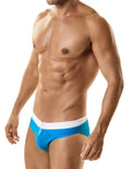 Bright blue swim trunks with white waistband and drawstring featuring WildmanT Banned swim w Ball Lifter cock-ring teal